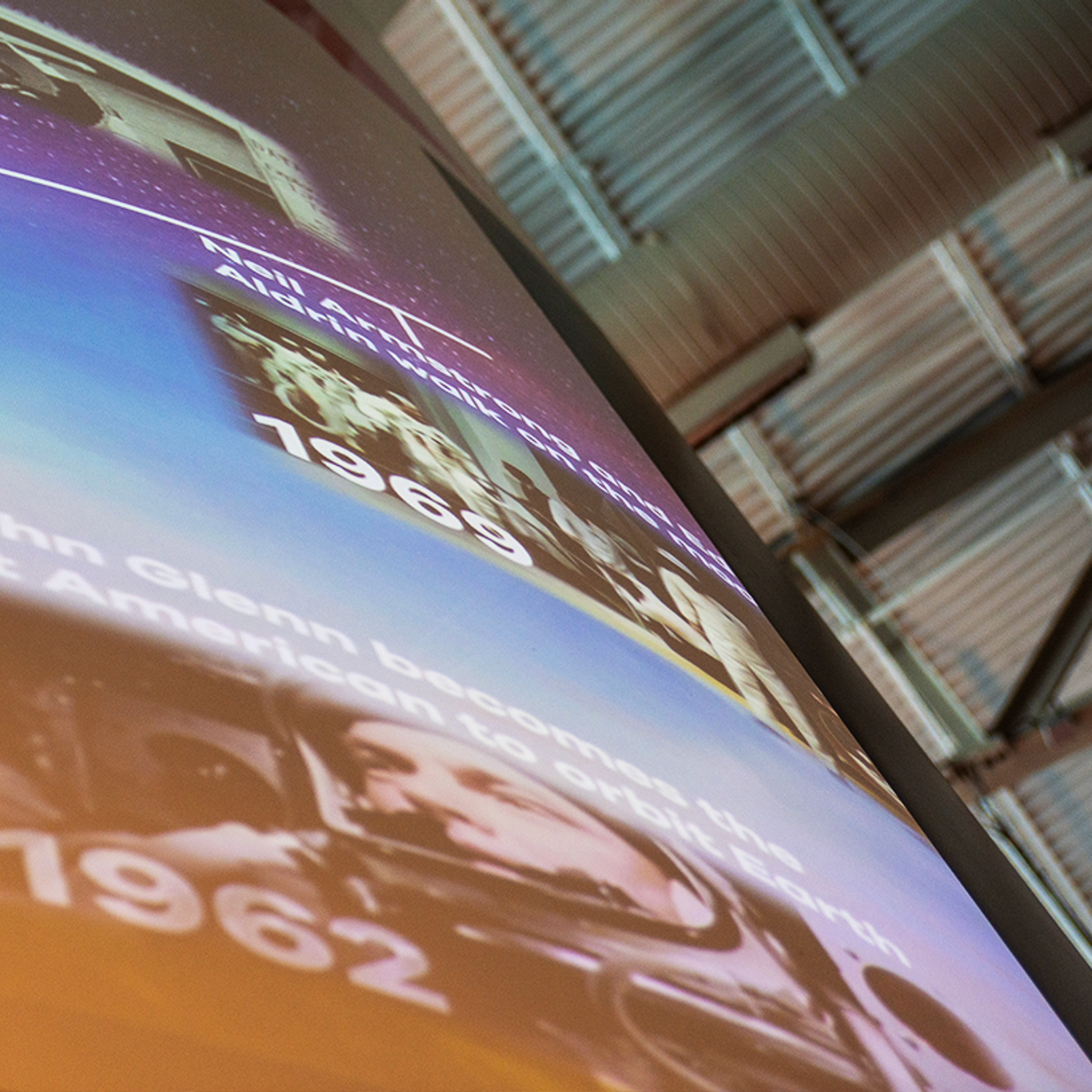 A rocket projection displaying a timeline of flight history, enabling visitors to absorb digital educational content effortlessly.