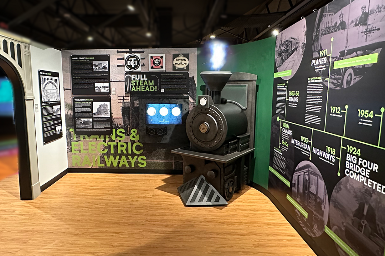 Guests solve digital engineering challenges, making the train roar into action with holographic FX.